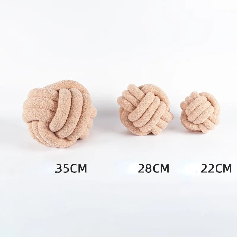 Knotted ball-shaped cushion