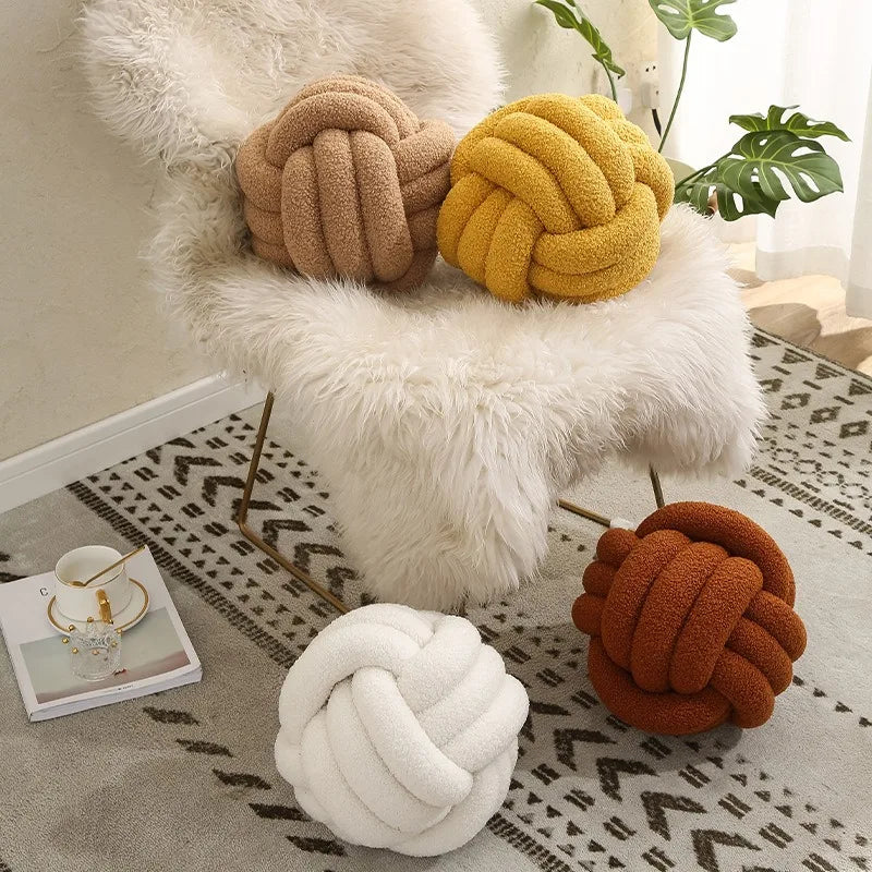 Knotted ball-shaped cushion